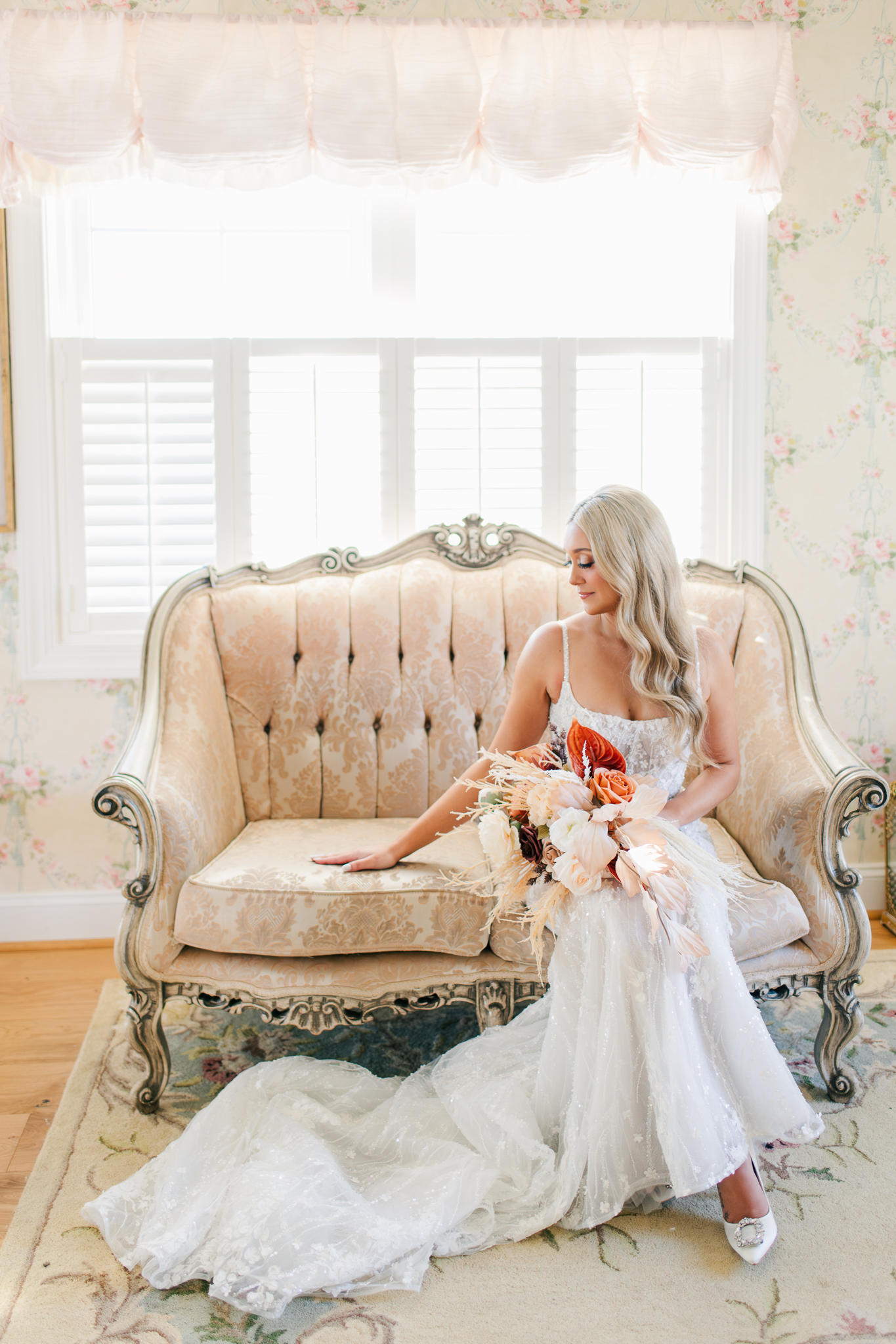 Romantic bridal portrait on a vintage couch at Bluebird Manor