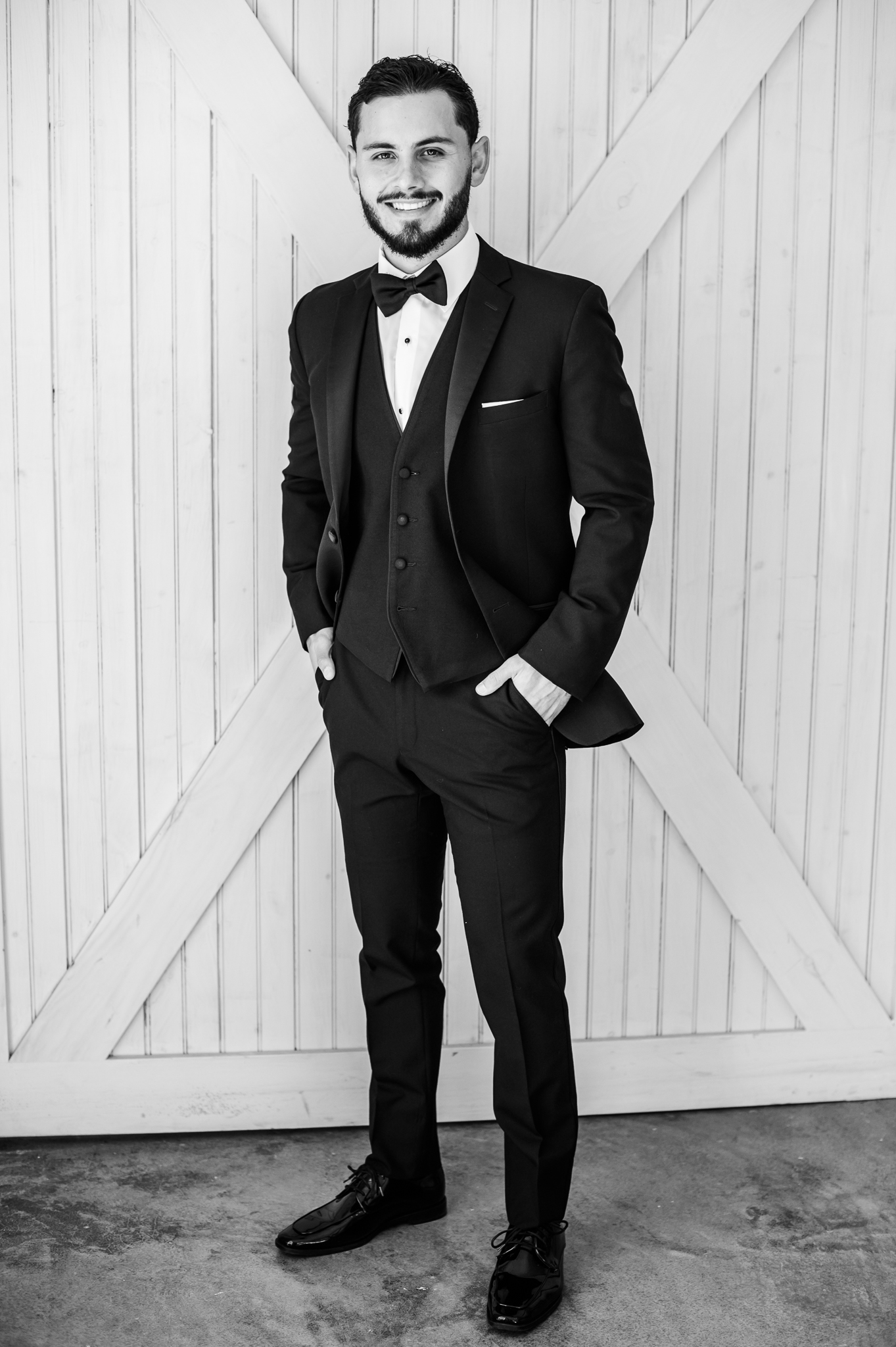 Black and white groom portrait at Bluebird Manor wedding venue