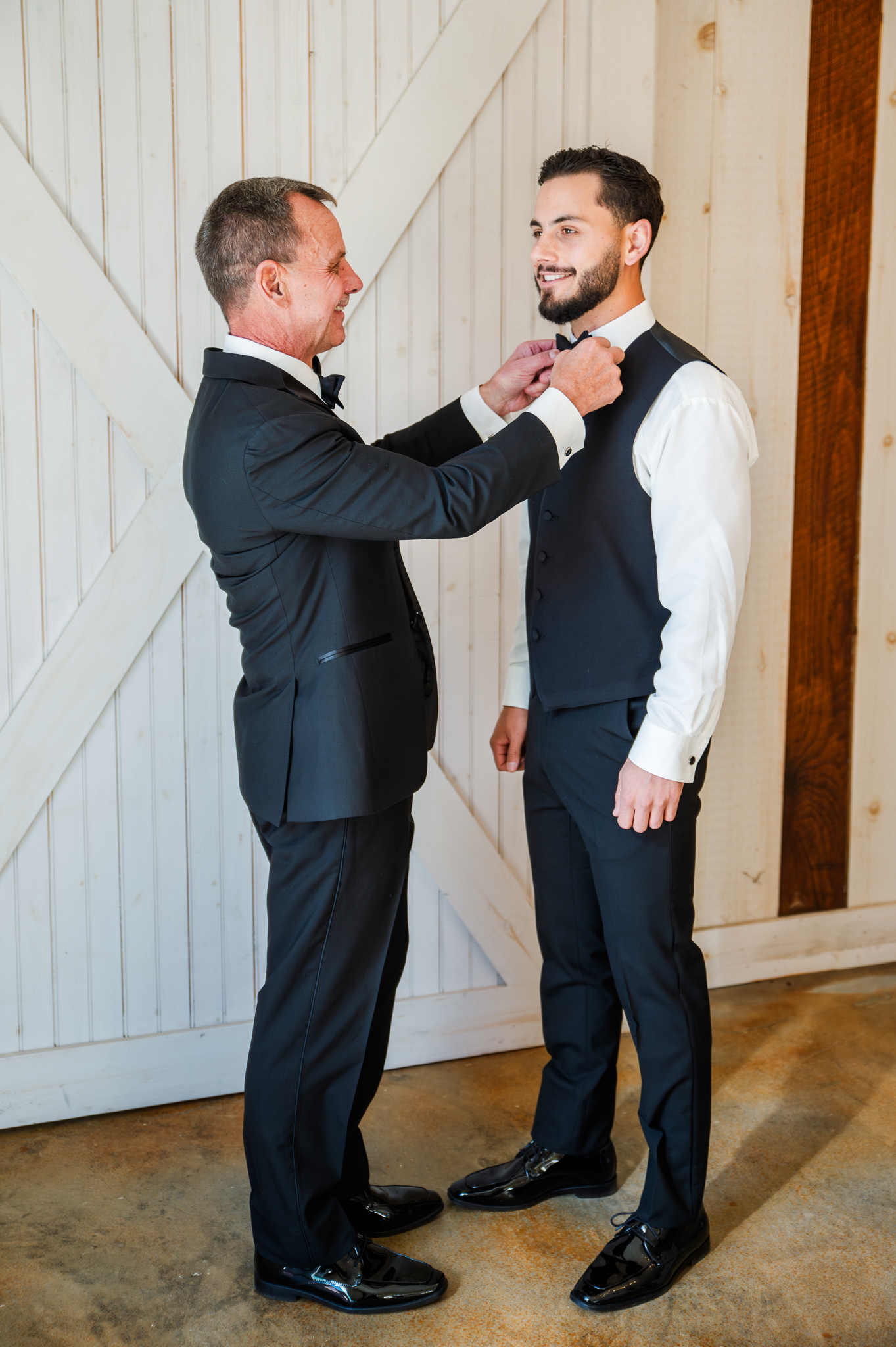 Groom getting ready with his father before a Bluebird Manor wedding