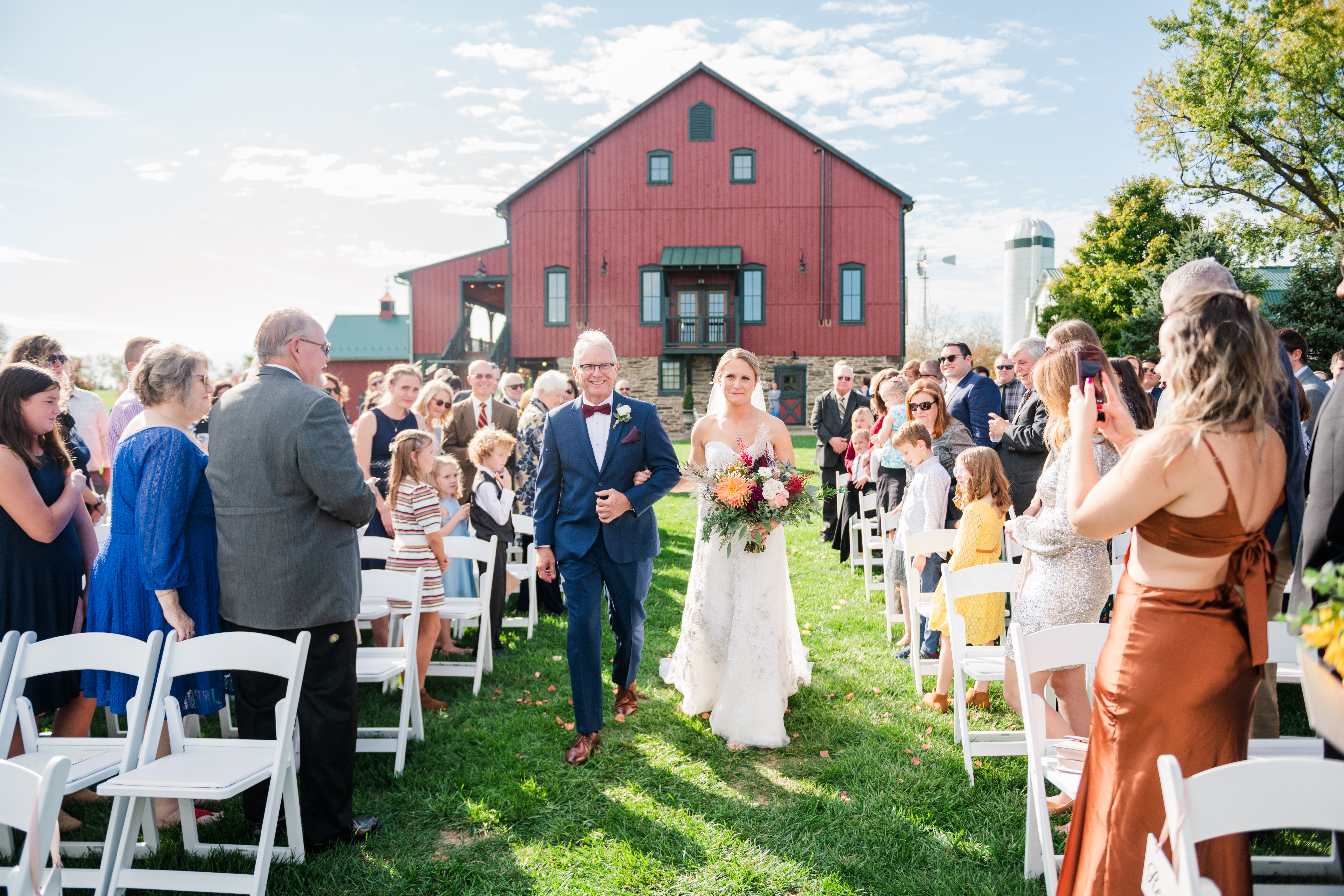 Outdoor wedding ceremony recessional at Bluebird Manor
