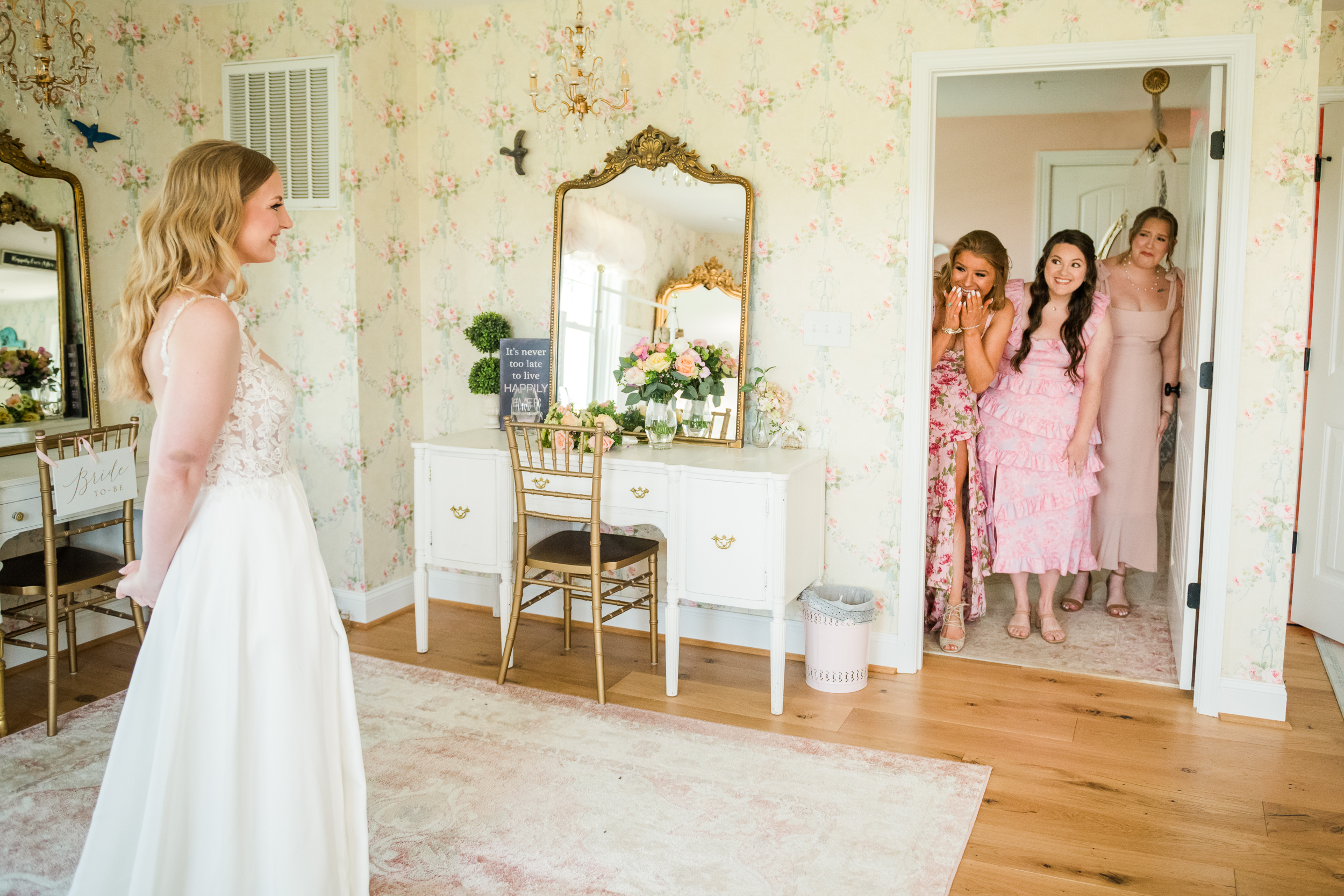 bride and bridesmaid first look at Bluebird Manor