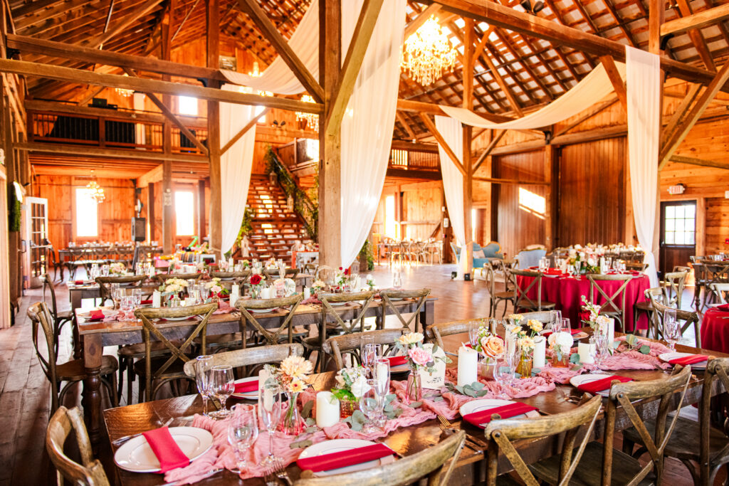 Bluebird Manor reception space with wooden beams and chandeliers