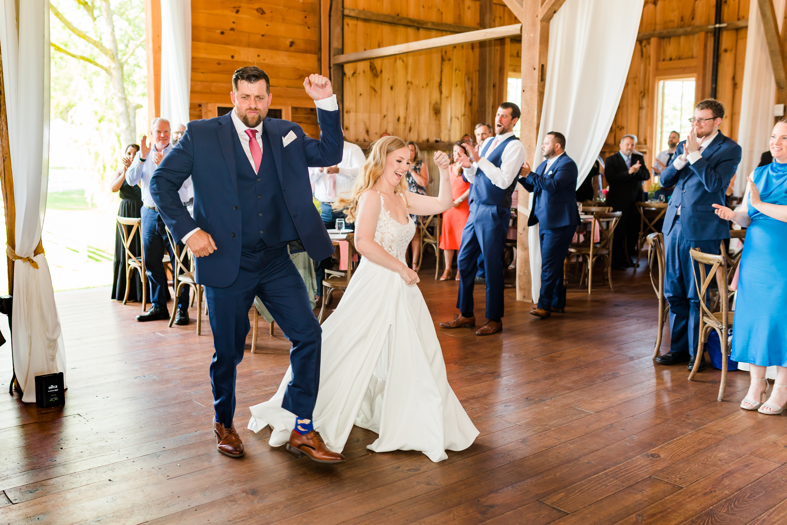 Bride and groom entering their wedding reception at Bluebird Manor