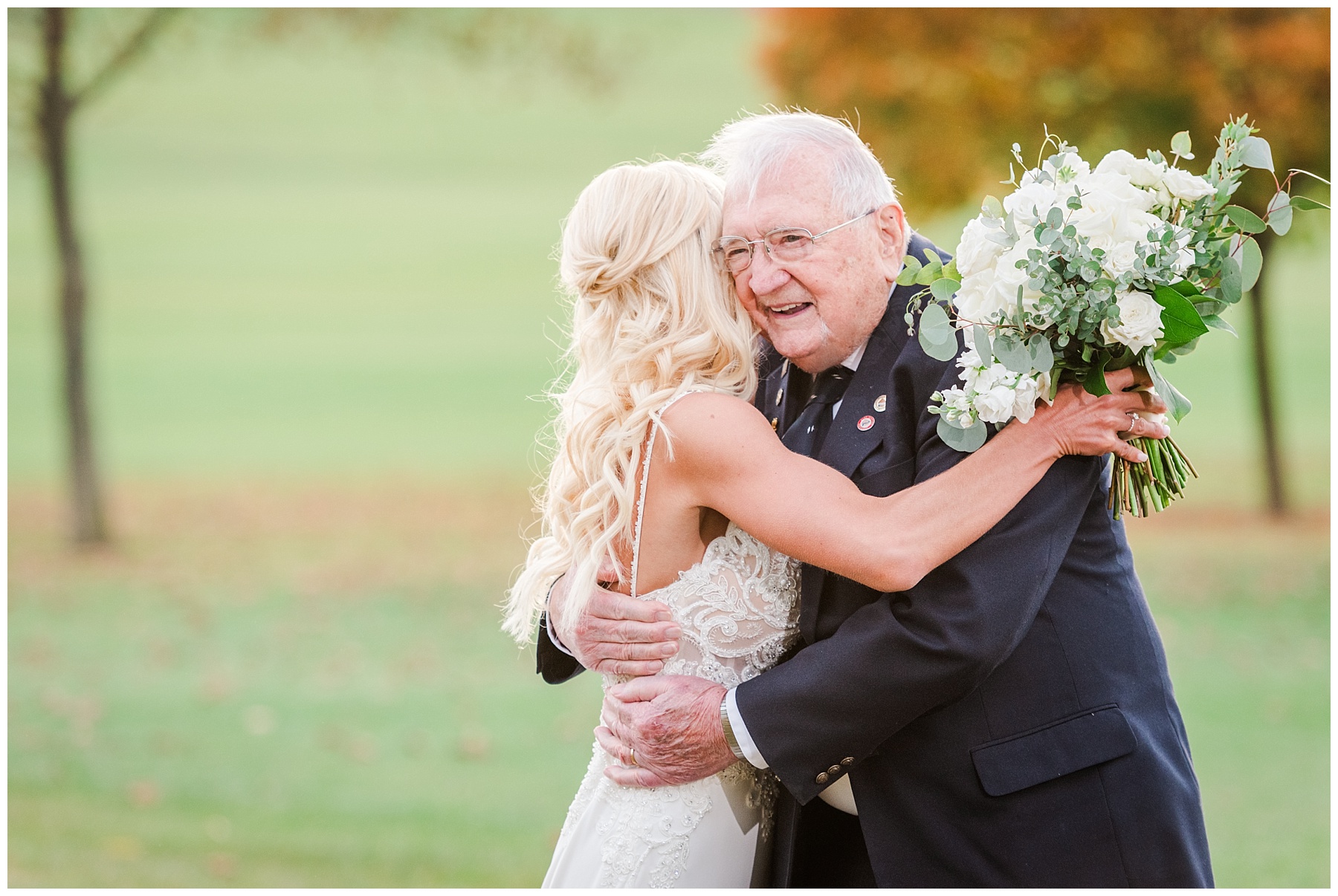 Bride grandfather hugging