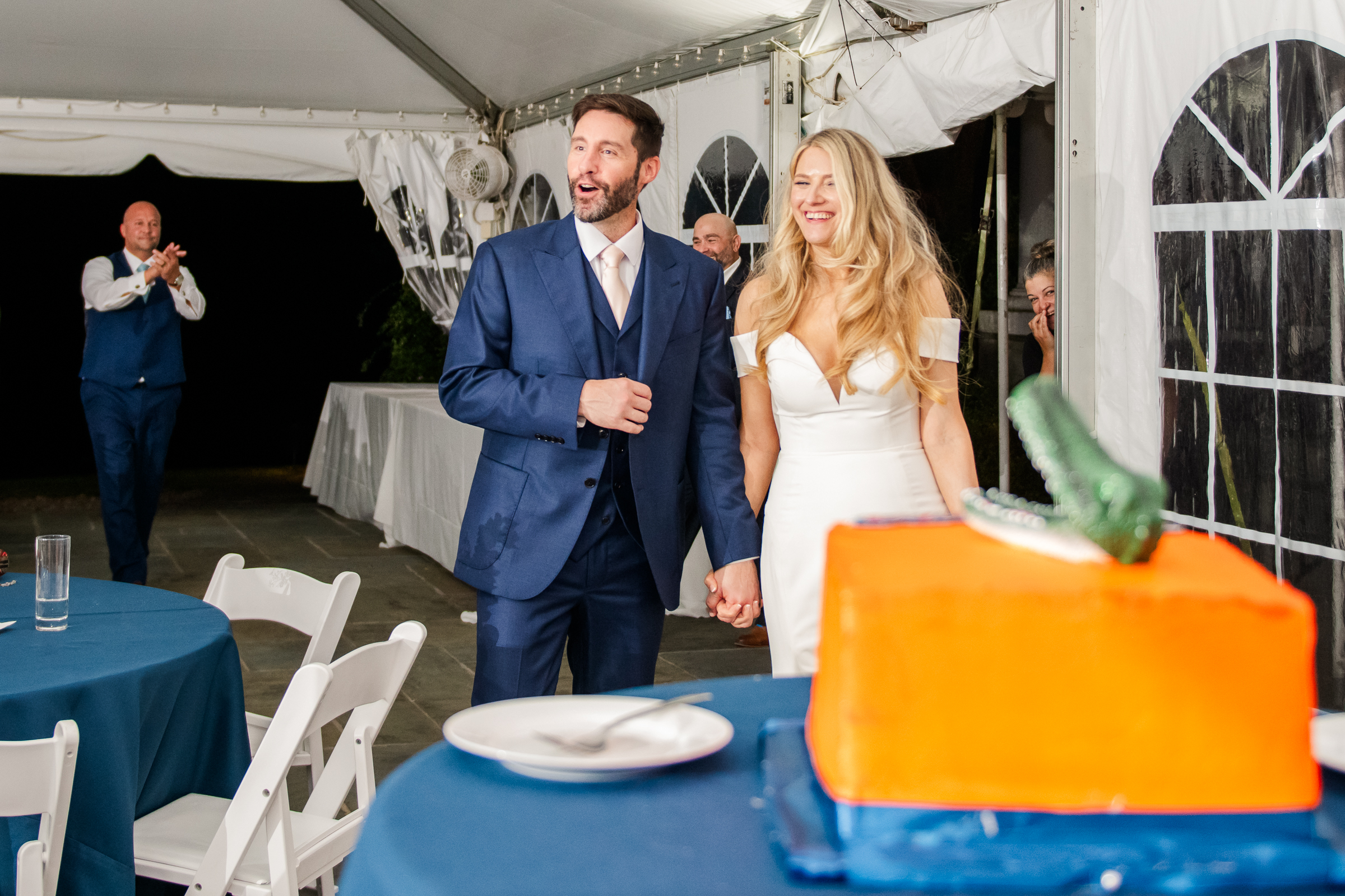 Groom reacting excitedly to his surprise Florida Gators groom cake.