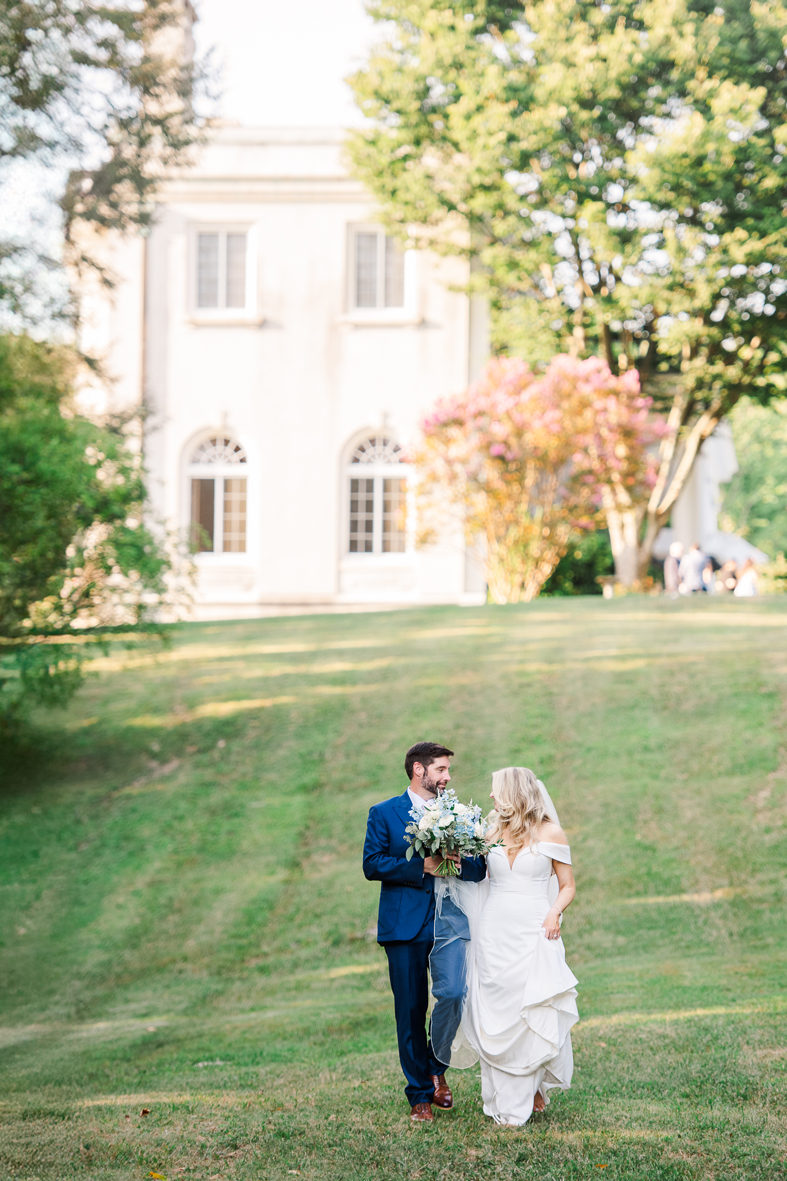 A sweet candid moment of a bride and groom walking together