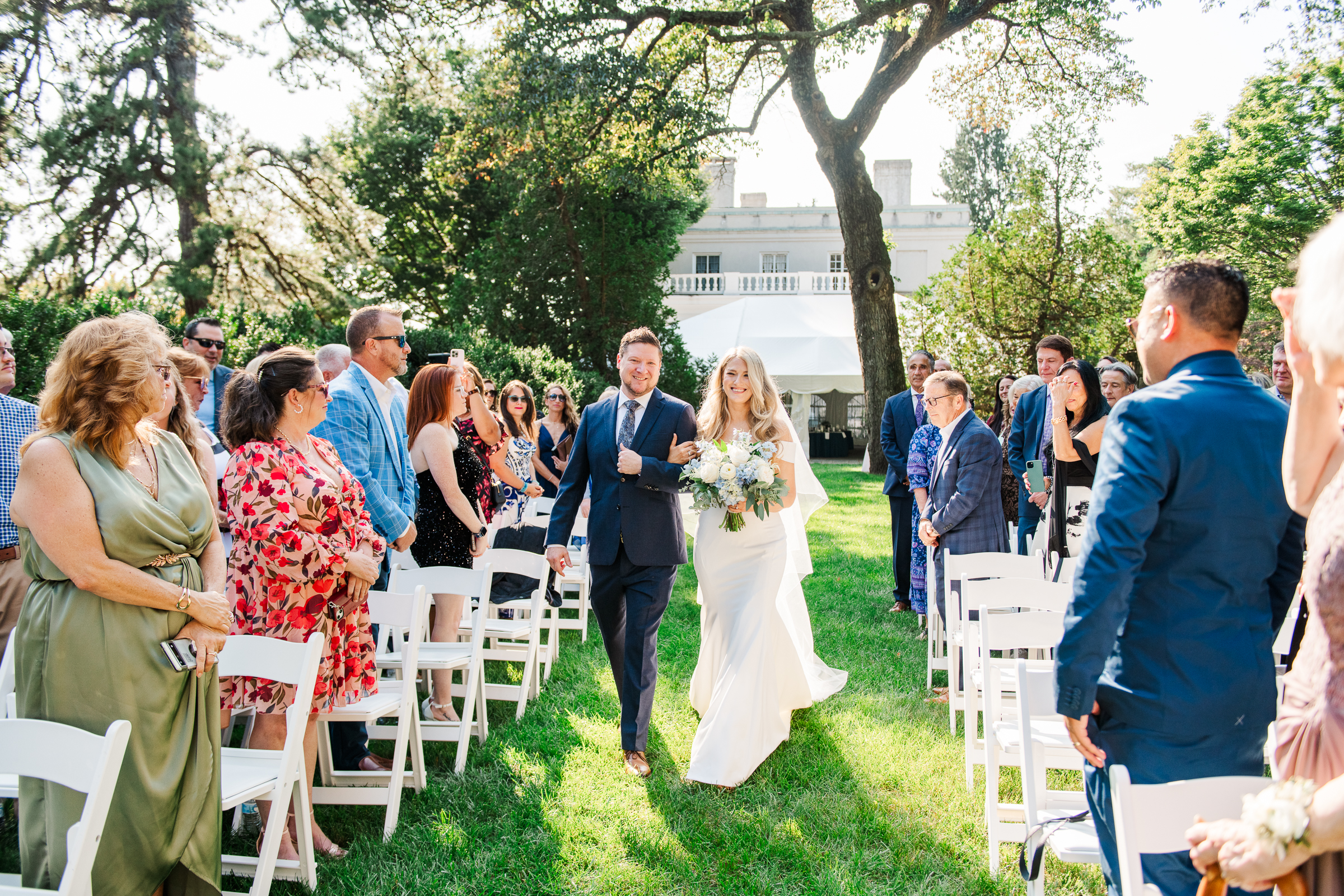 Bride walks down the aisle with her brother at the beautiful Strong Mansion in Frederick, MD.